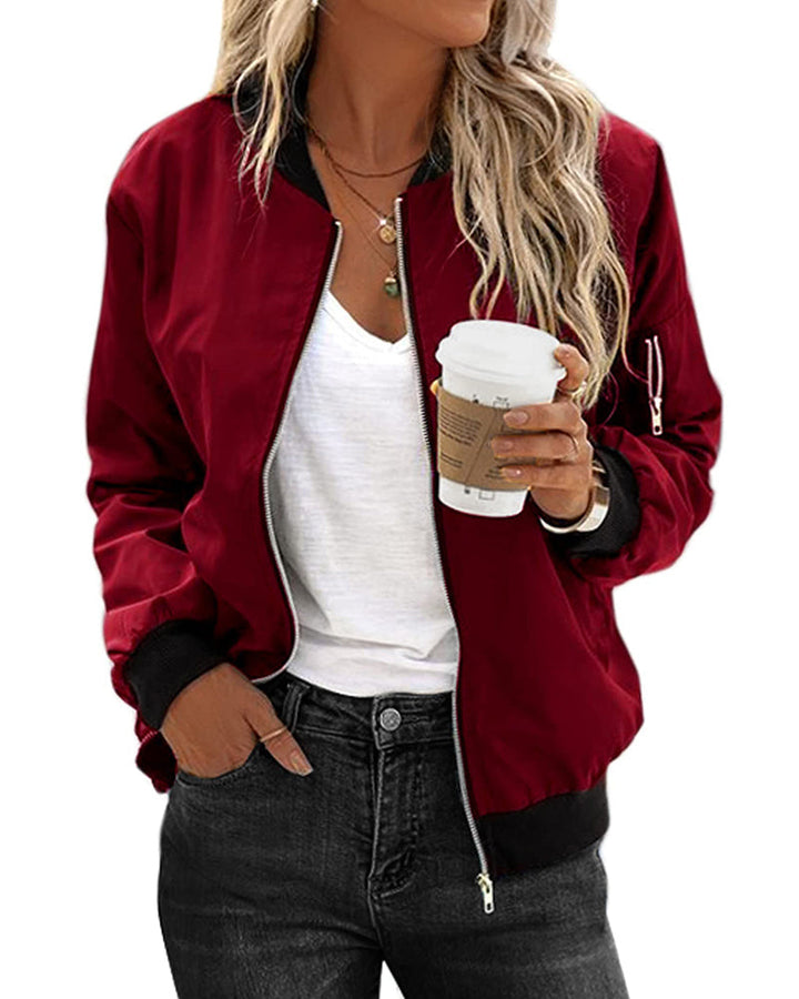 Stylish women's green zip-up bomber jacket, casual outerwear for spring & fall fashion. Effortless everyday wear.