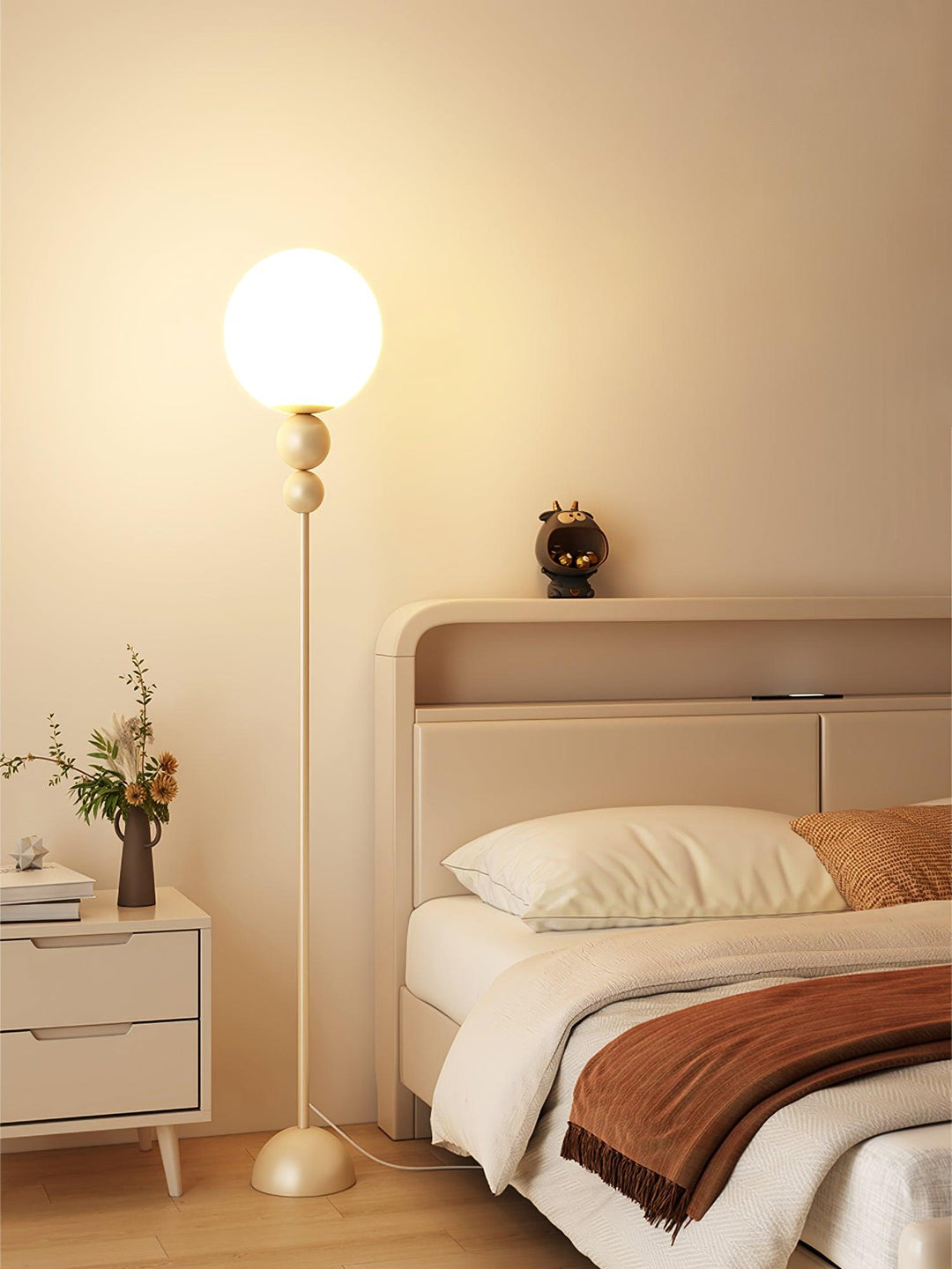 Green metal & glass floor lamp, providing sophisticated ambient light.