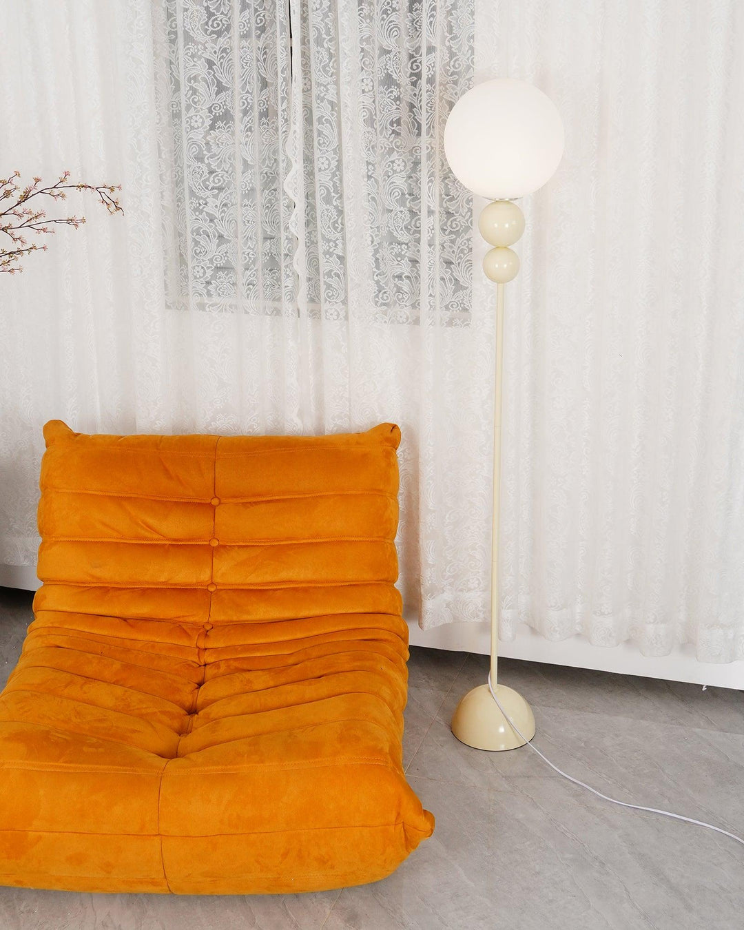 Sleek milky white modern metal & glass floor lamp, an aesthetic addition to home decor.