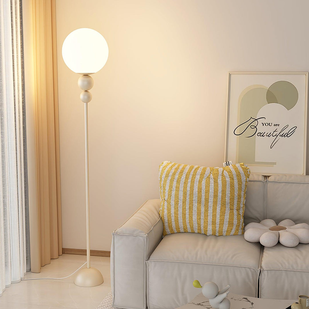 Green modern floor lamp, a stylish metal & glass light for elegant homes.
