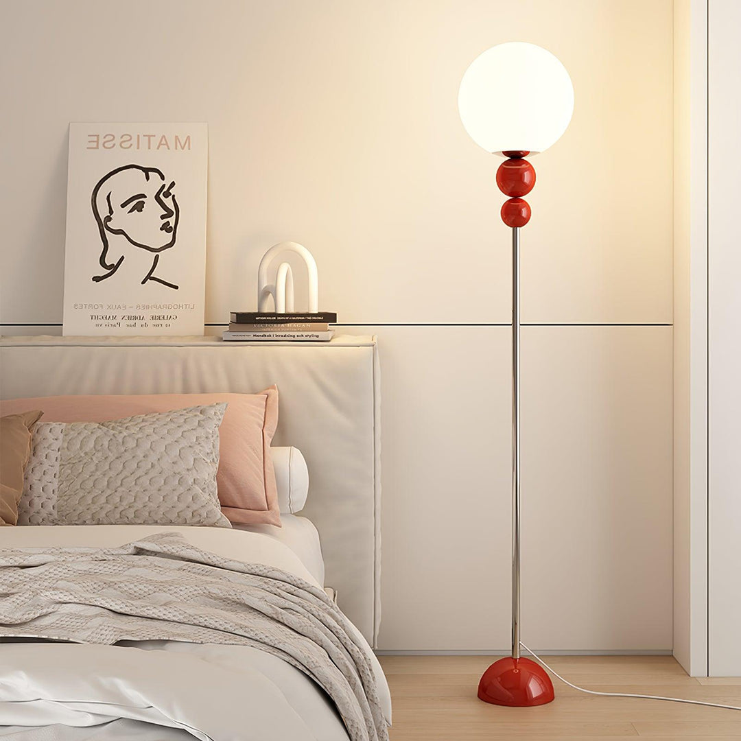 Green contemporary floor lamp with metal & glass, perfect for home accent lighting.