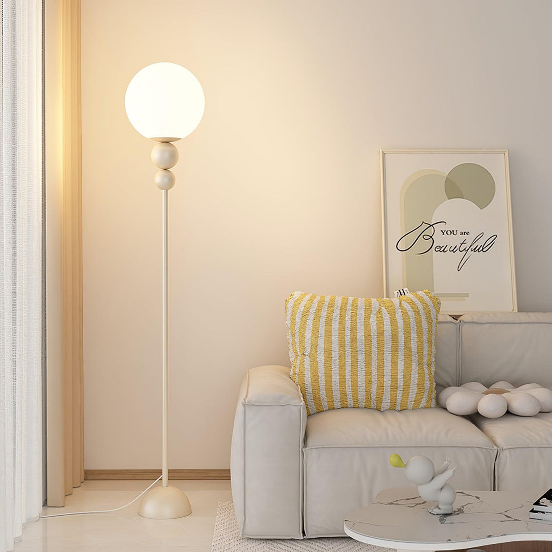 Red glass & metal floor lamp, a striking modern piece for living room decor.