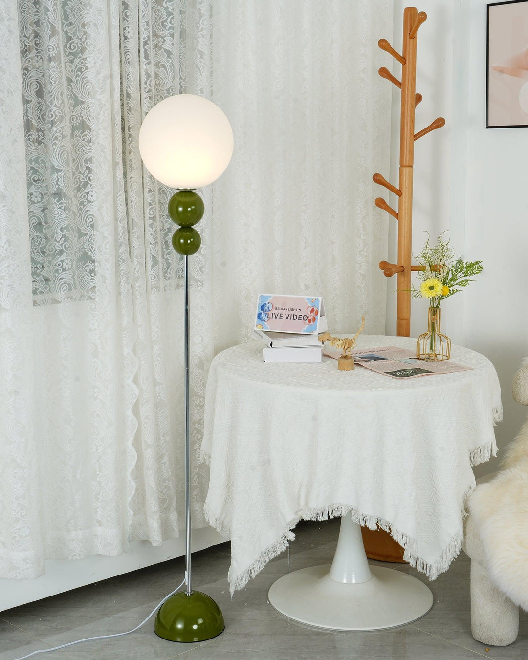 Sleek green modern metal & glass floor lamp, an aesthetic addition to green home decor.