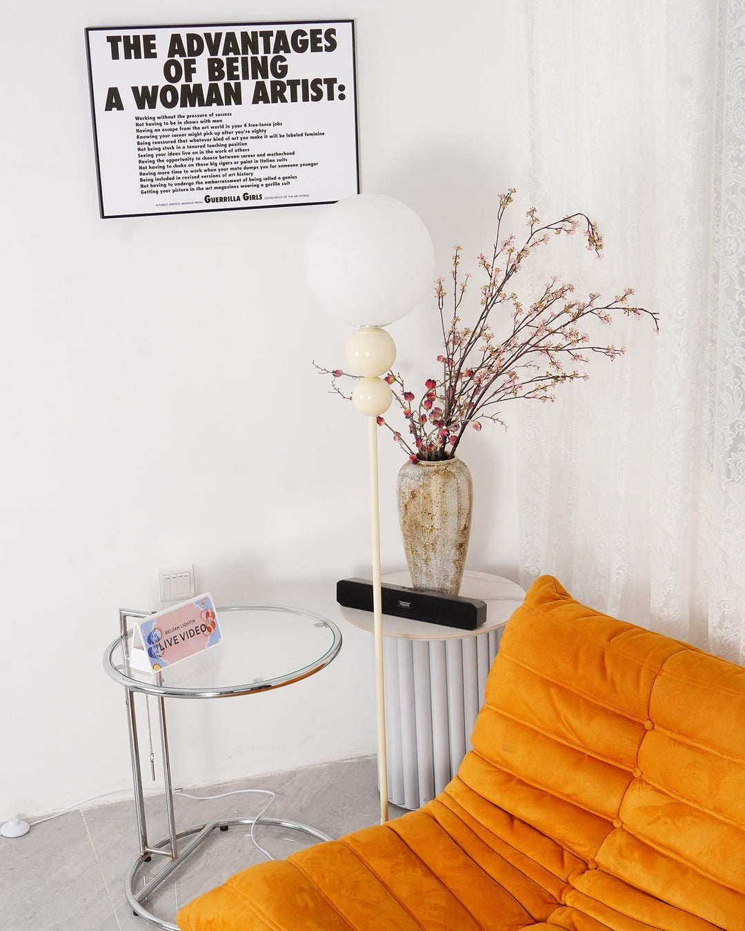 Modern milky white accent lamp, metal base with elegant glass shade, for indoor settings.