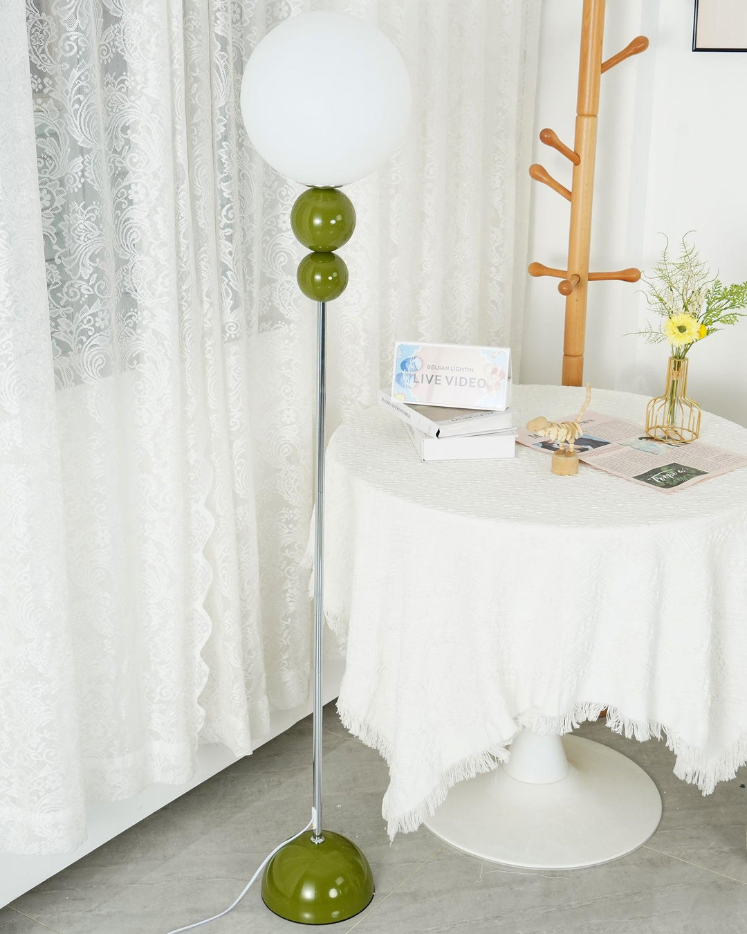 Contemporary green floor lamp, metal and glass, perfect for a cozy bedroom light.