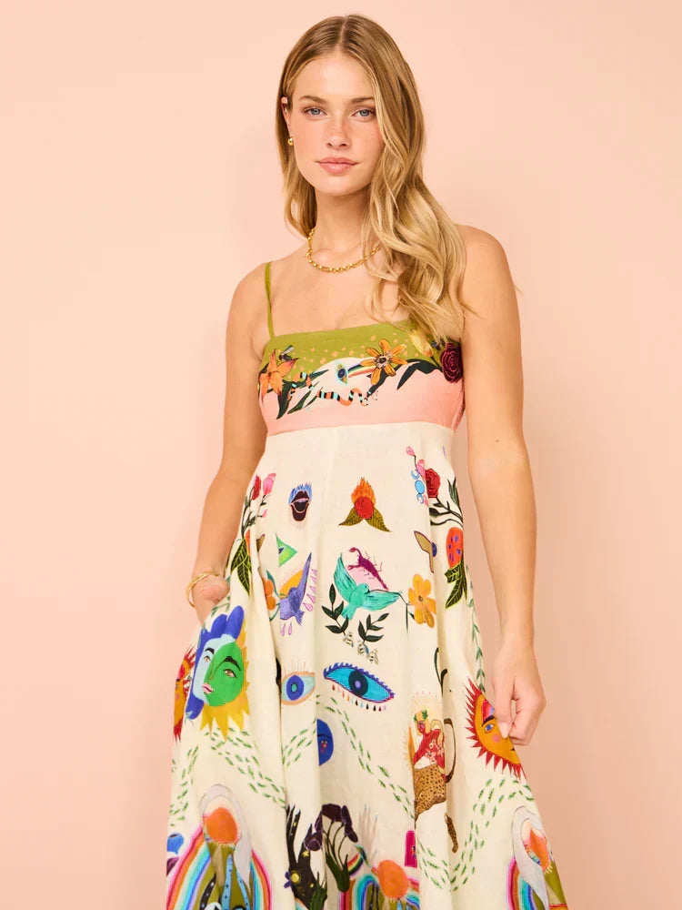 Women's flowing spaghetti strap maxi dress in a boho style, perfect as a vibrant summer sundress.
