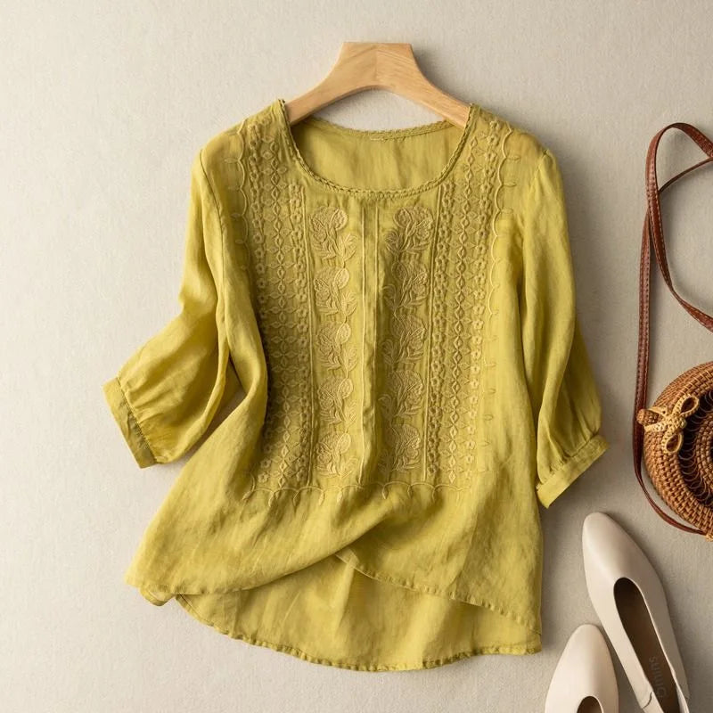 Elegant women's sheer puff sleeve blouse. Romantic embroidered top, versatile for casual or dressy occasions.