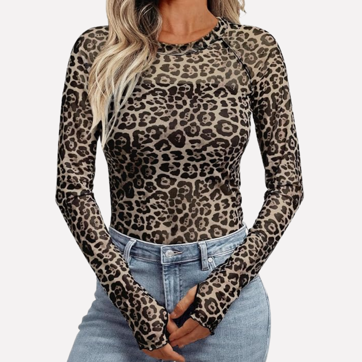 Women's elegant sheer patterned long sleeve top, ideal for evening outings. Slim fit, chic party wear blouse.