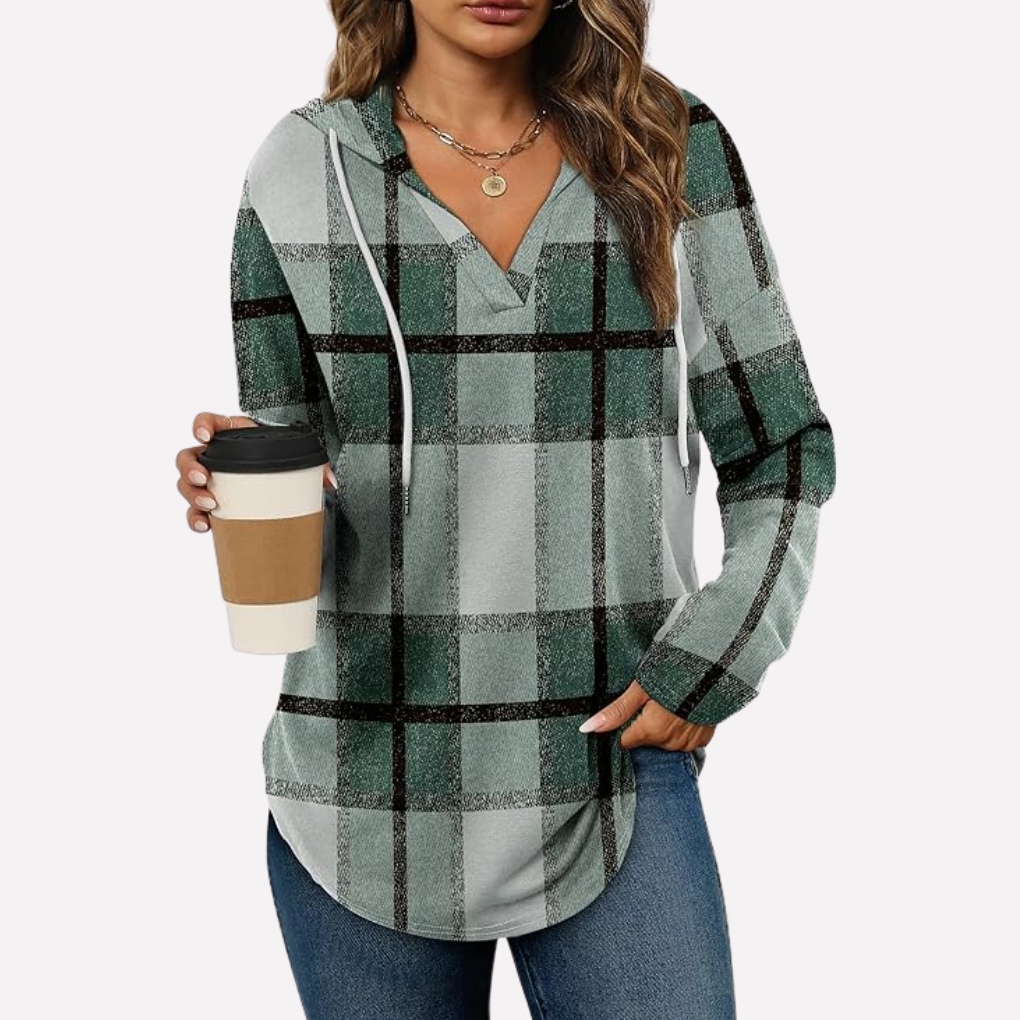Women's oversized hooded pullover, a cozy essential for casual style and ultimate comfort.