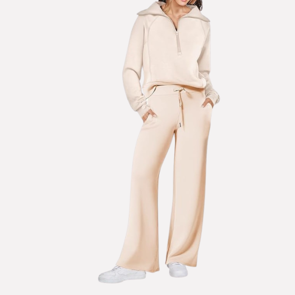 Stylish women's matching set featuring a top and wide-leg pants with elastic waist. Ideal for travel & lounge.