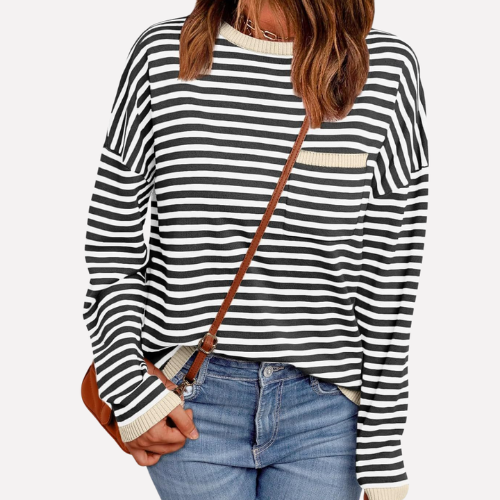 Comfortable women's striped knit top featuring a cozy relaxed fit and effortless everyday fashion.