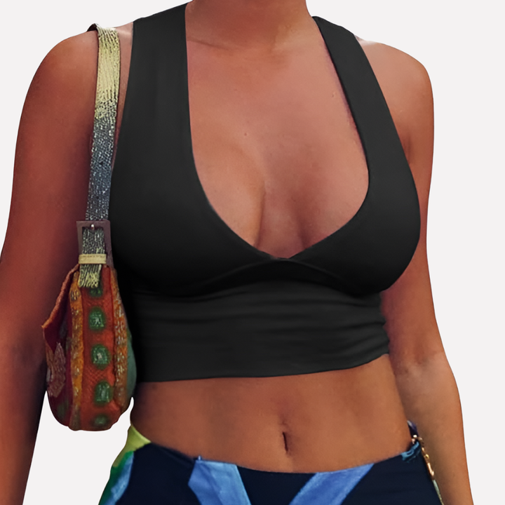 Trendy women's sleeveless cropped top with racerback and front cutout detail, ideal for versatile summer outfits.