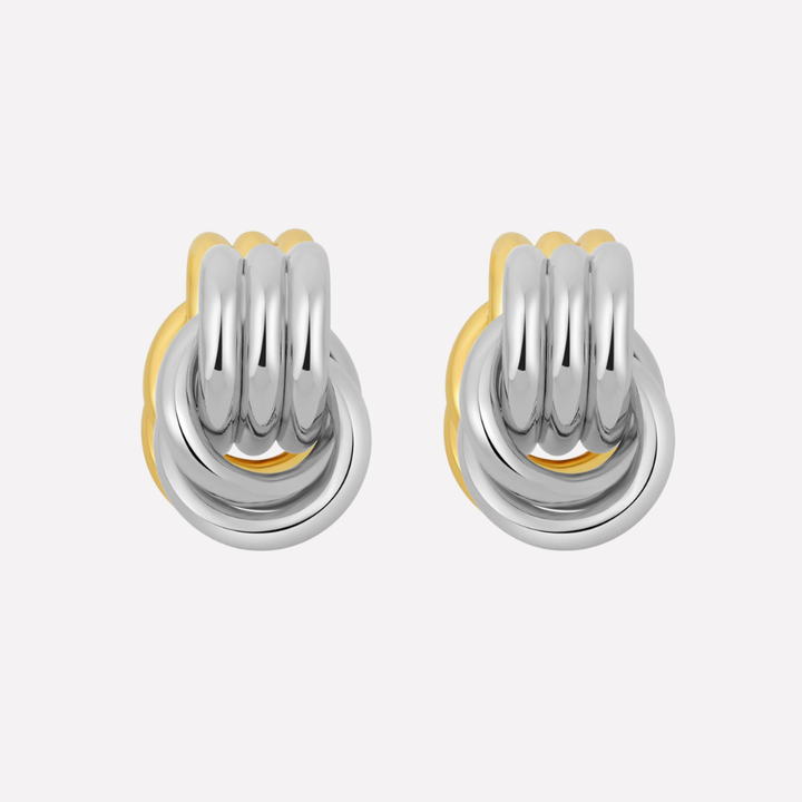 Women's elegant knot drop earrings in a shimmering gold and silver finish.