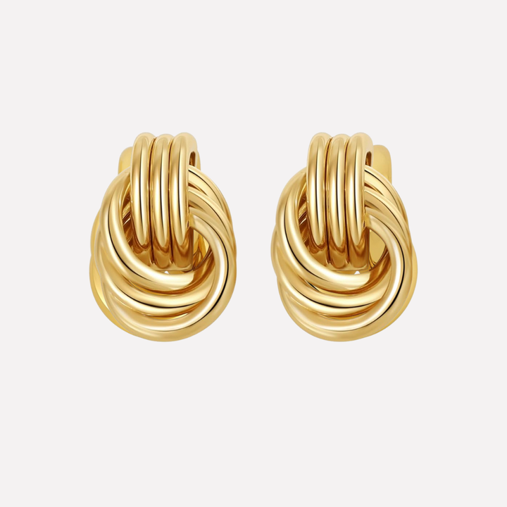 Gold knot dangle earrings, an elegant accessory to elevate any outfit.
