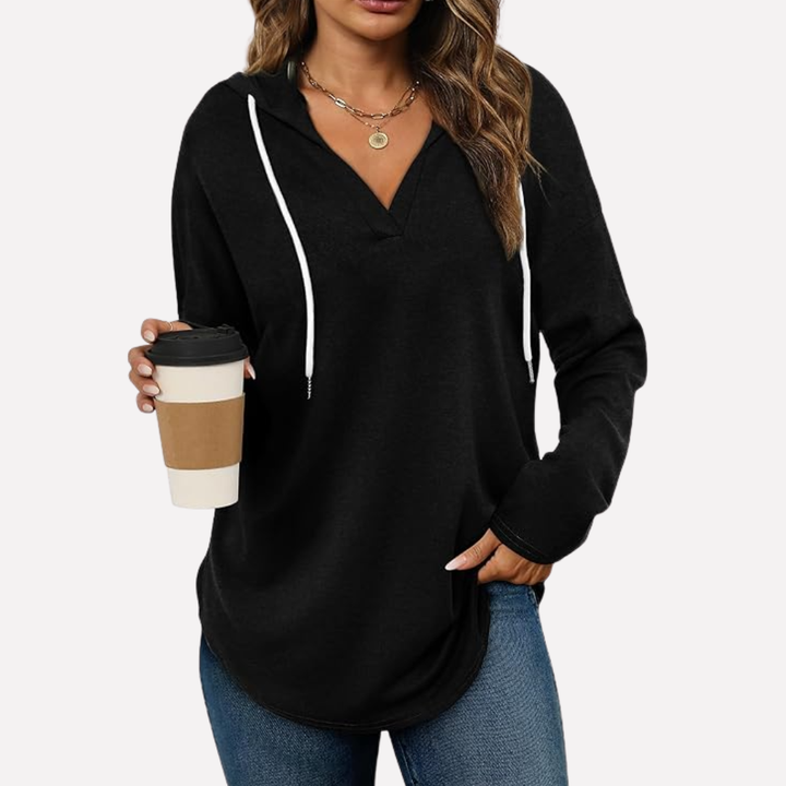 Relaxed fit women's oversized hooded sweatshirt, perfect loungewear and casual fall fashion.
