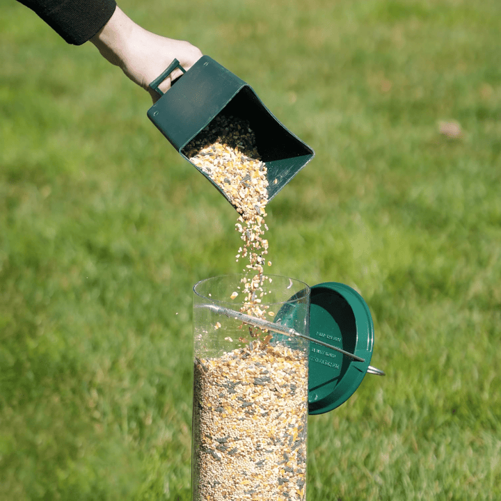 Weatherproof birdhouse with secure squirrel-proof design & multiple feeding stations for various wild birds.