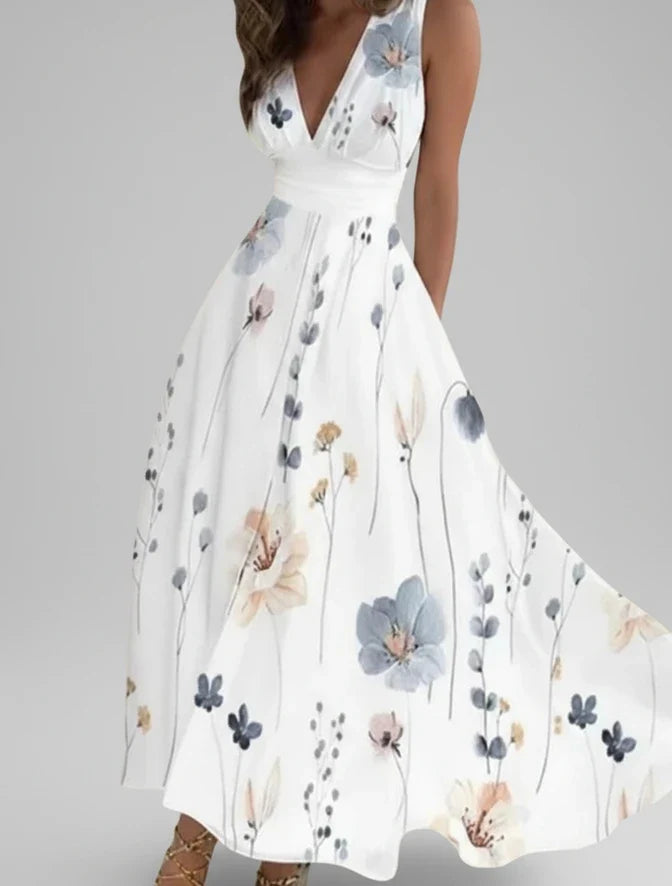 Sleeveless floral V-neck A-line midi dress for women. A chic and flowy summer dress, great for vacation.