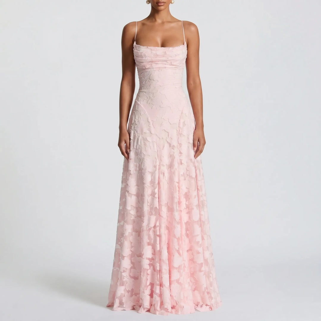 Women's elegant floral textured maxi dress with thin spaghetti straps. A graceful long gown for any party.