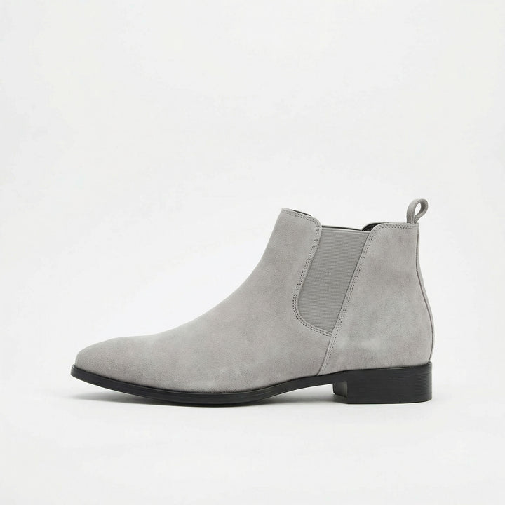 Premium brown leather Chelsea boots for men. Comfortable, versatile slip-on footwear for any occasion.