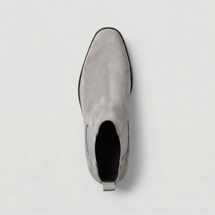 Modern grey men's Chelsea boots. Stylish & versatile slip-on footwear for everyday comfort and flair.