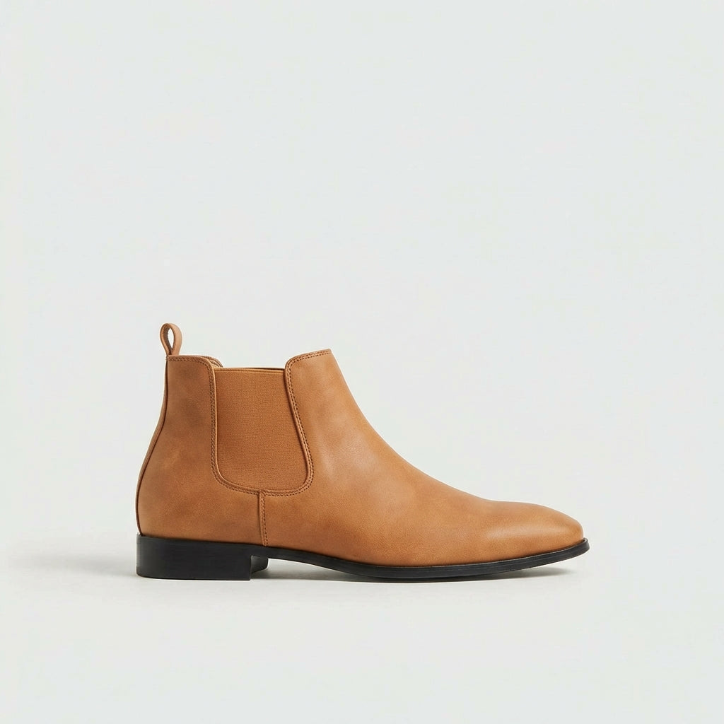 Grey stylish men's Chelsea boots. Versatile slip-on footwear designed for everyday comfort and elegance.