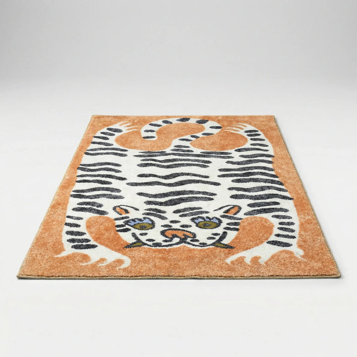 Washable tiger print area rug with a vibrant, playful design, perfect for a child's playroom.