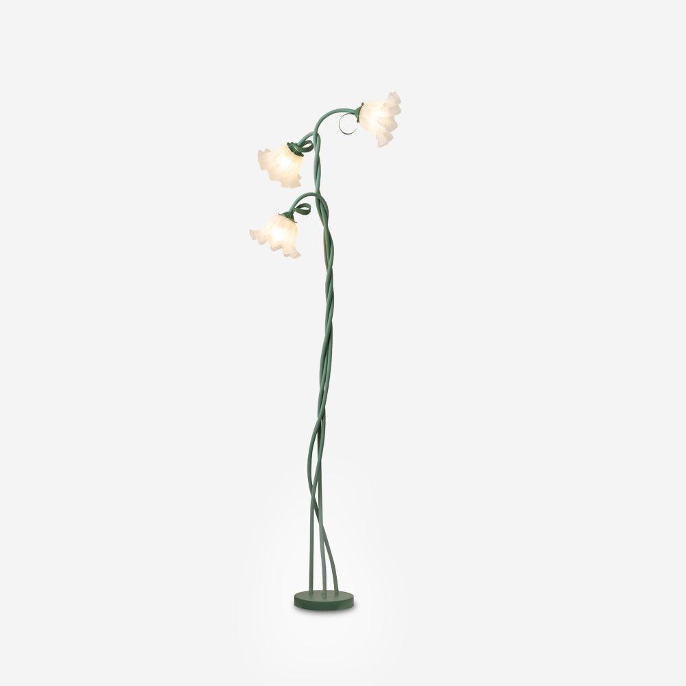 Green botanical floor lamp, white shade, adds a modern floral touch to any room decor.