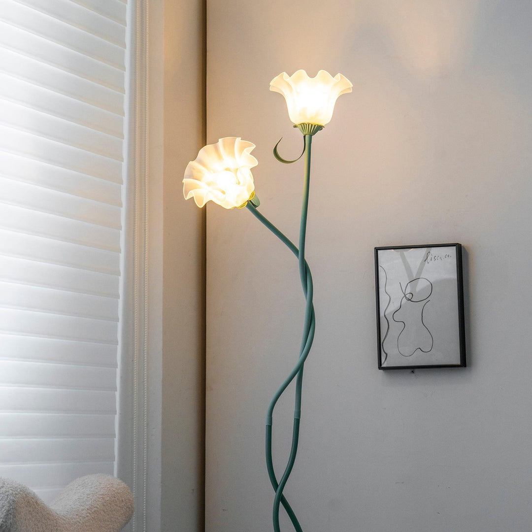 Green floor lamp with elegant white shade, botanical floral pattern, modern style.