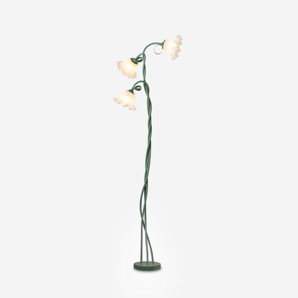 Elegant green floral lamp, floor standing, modern design, white shade for ambient glow.