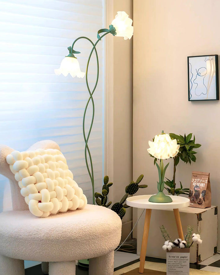 Botanical green floor lamp with intricate floral design, ambient living room lighting.