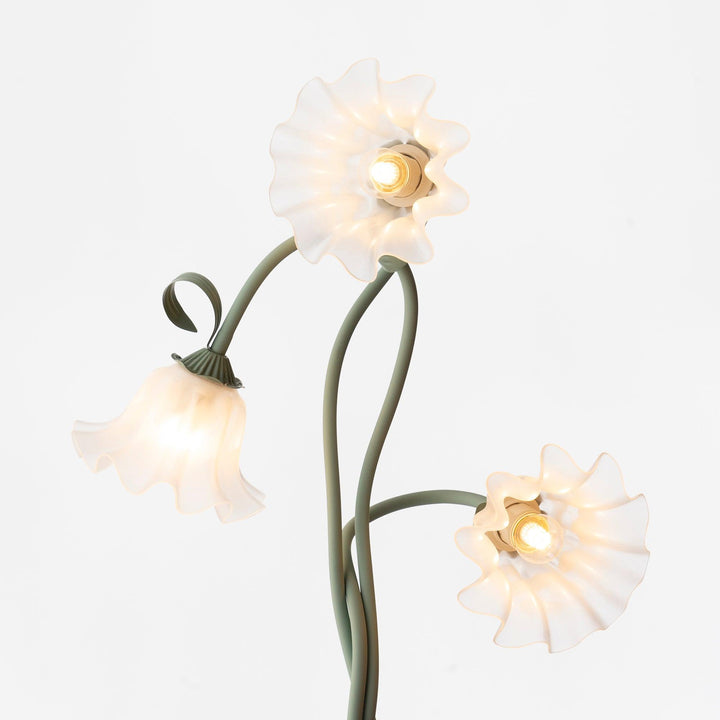 Tall green floral floor lamp featuring a crisp white shade for contemporary decor.