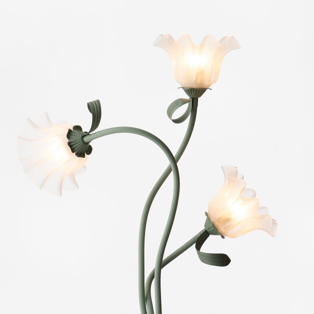 Floor lamp: Green floral design, white shade. Modern botanical light for contemporary decor.