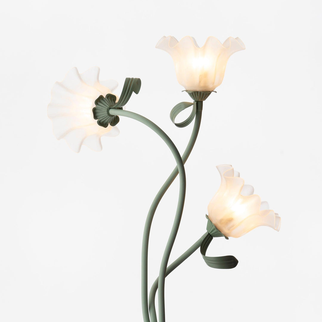 Green floral floor lamp, sleek modern design, white shade, ideal for living rooms.