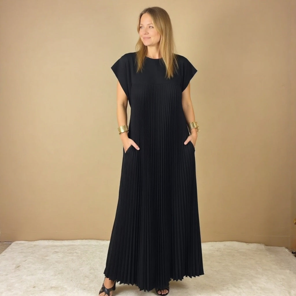 Lightweight women's pleated maxi dress, essential for comfortable, elegant summer style & versatile occasion wear.