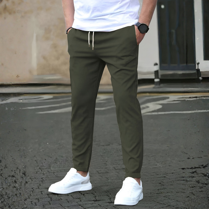 Stylish men's slim fit trousers with an adjustable drawstring, great for a modern casual look.