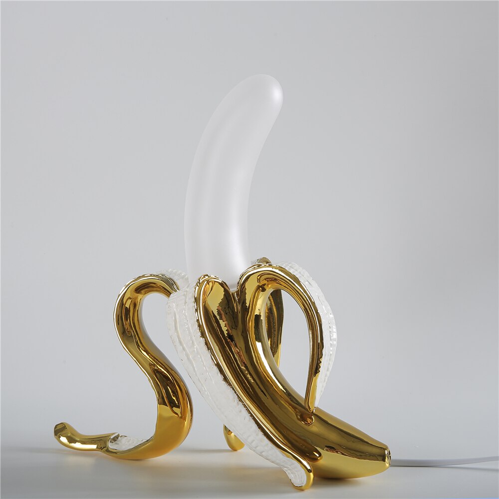 Modern table lamp, elegant brass & chrome finish, unique decorative lighting for living room decor.
