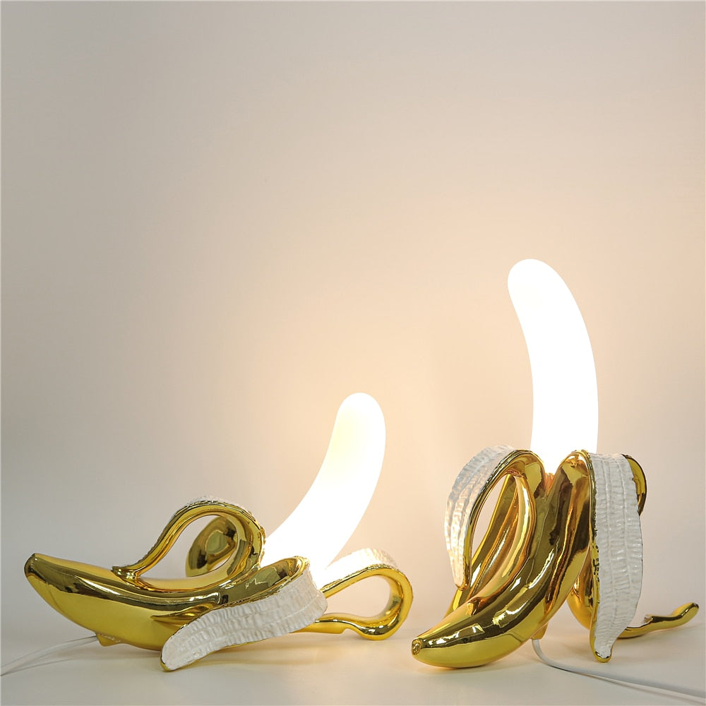 Contemporary brass and chrome table lamp, elegant design, ideal for sophisticated home decor.