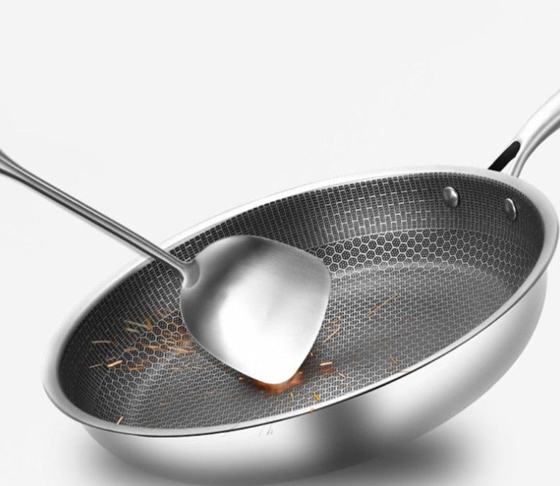High-quality stainless steel skillet with unique textured non-stick cooking surface. Durable kitchen cookware.