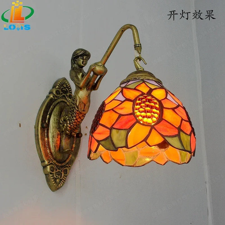 Whimsical mermaid glass LED wall light, artistic decor for a magical ambiance.