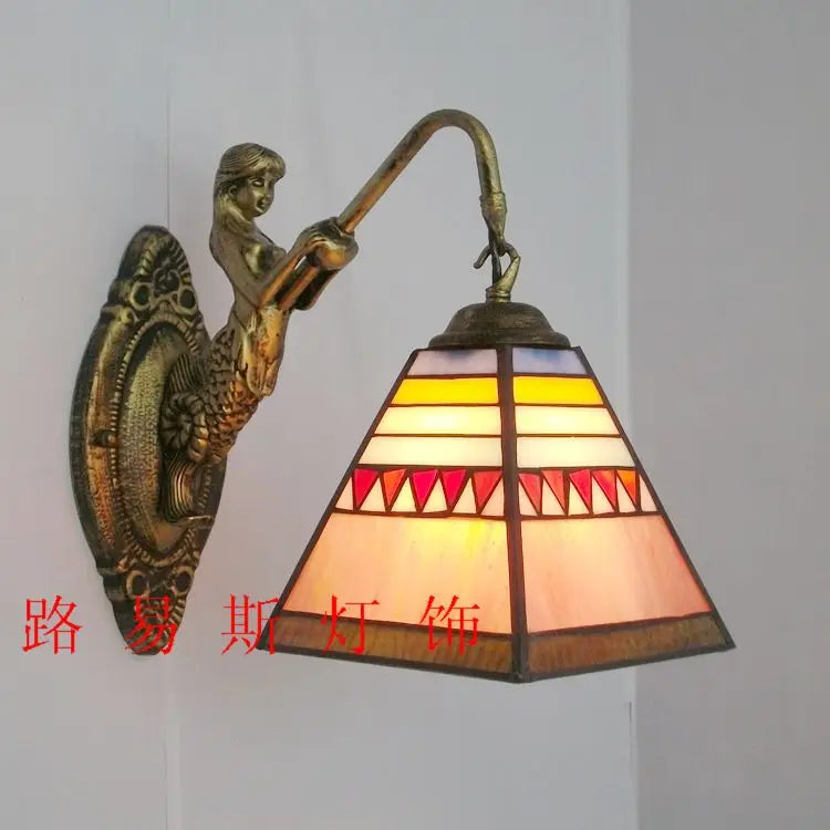 Vibrant mermaid stained glass LED wall light, a focal point for artistic home decor.
