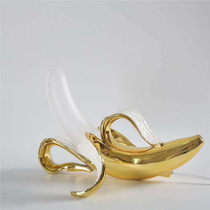 Decorative brass table lamp with chrome details, modern lighting fixture for any room.