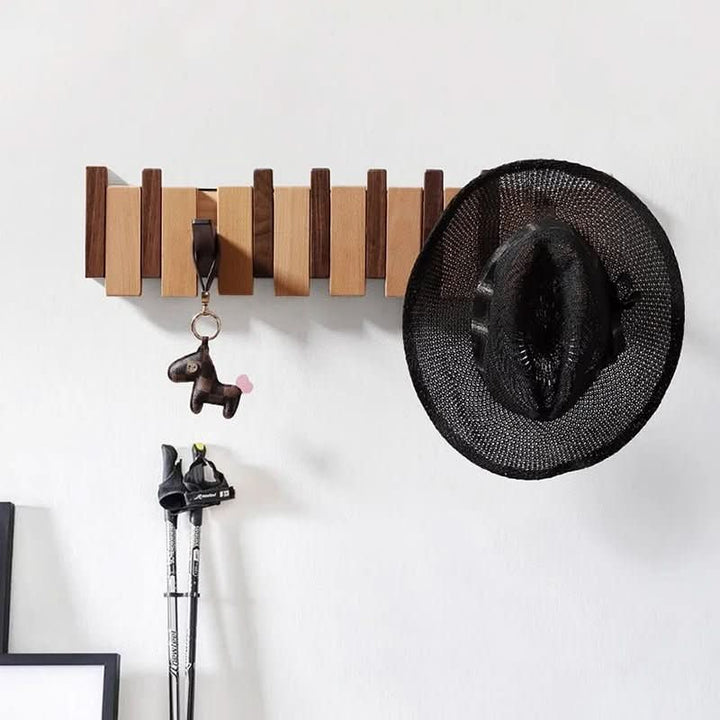 Beautiful piano design wall coat rack, ideal for organizing coats and bags in a modern entryway.