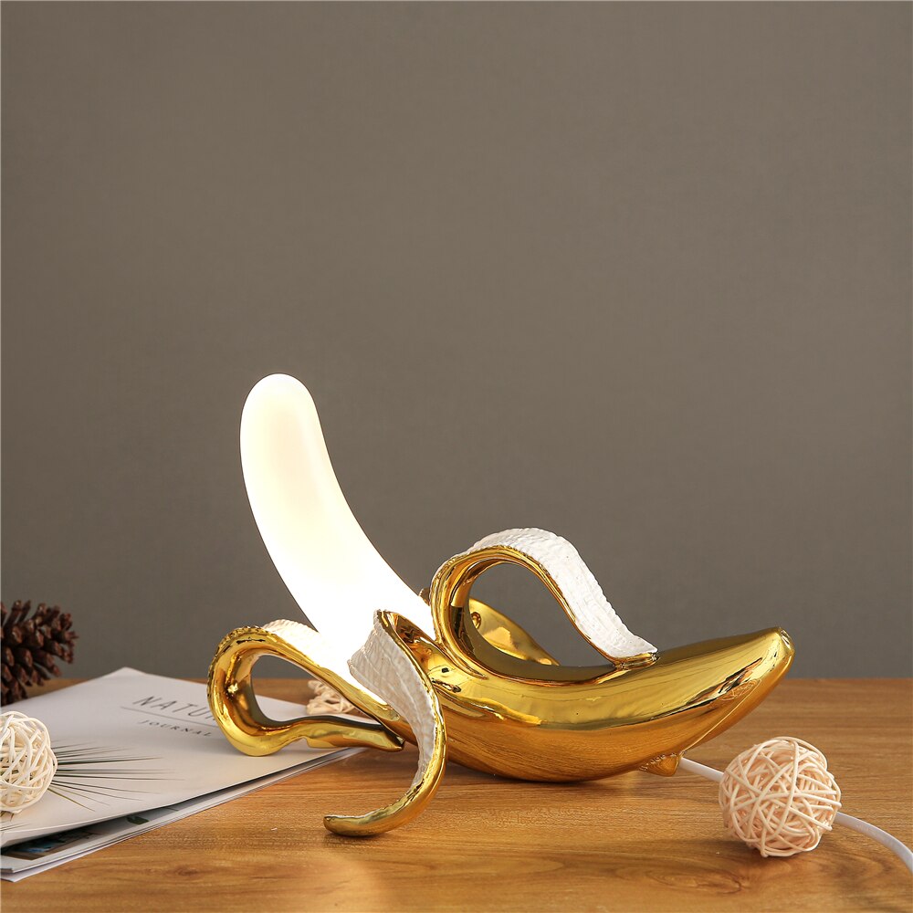 Unique brass & chrome table lamp, modern aesthetic, adds a stylish accent to your space.