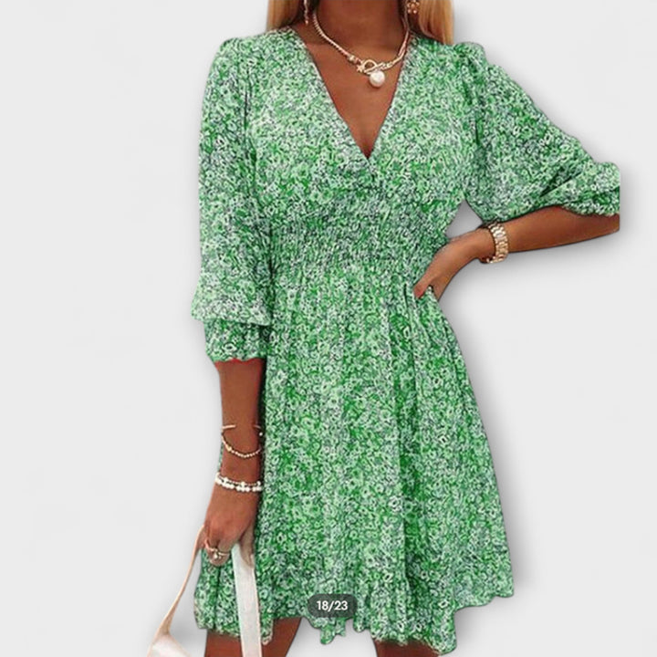 Elegant women's floral A-line midi dress with stylish puff sleeves. Ideal for garden parties & summer events.