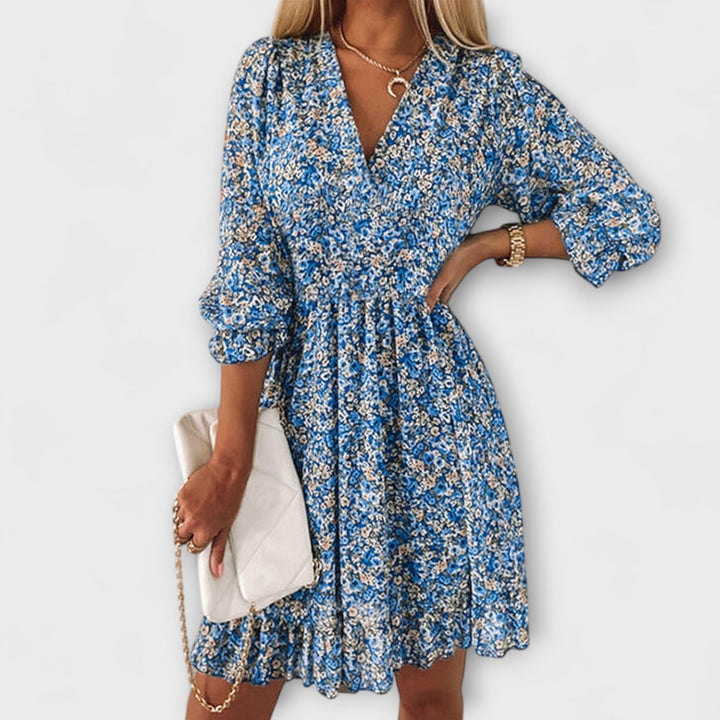 Stylish women's floral midi dress featuring puff sleeves & an A-line silhouette. Versatile for day or party wear.