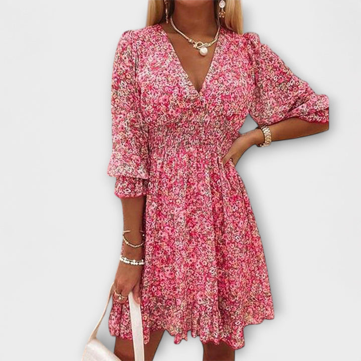 Women's floral A-line midi dress with puff sleeves. Perfect for summer, spring fashion & elegant occasions.