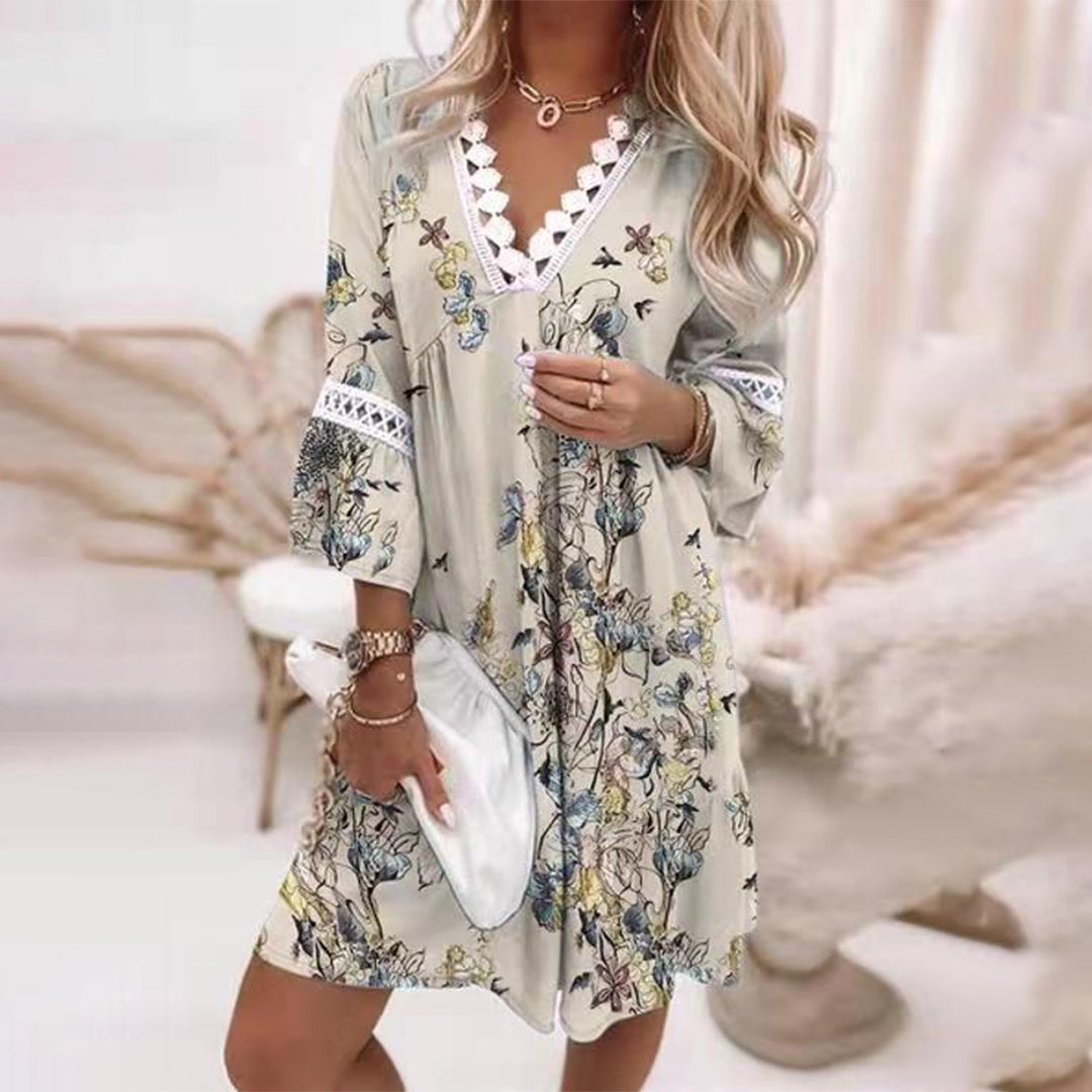 New effortless women's boho summer dress featuring elegant crochet details, a V-neck, and flowy knee-length style.