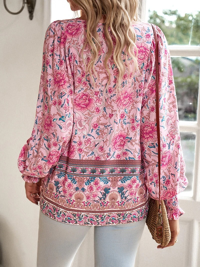 Women's casual floral puff sleeve blouse. This elegant short-sleeve top is comfortable and stylish for summer.