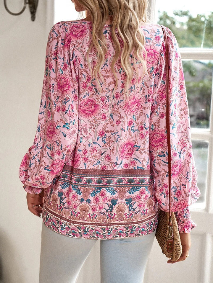 Women's casual floral puff sleeve blouse. This elegant short-sleeve top is comfortable and stylish for summer.