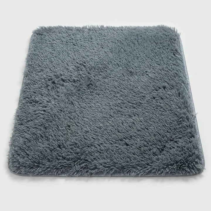 Washable plush low pile floor mat with non-slip backing, featuring a stylish wave design. Ideal kitchen rug.
